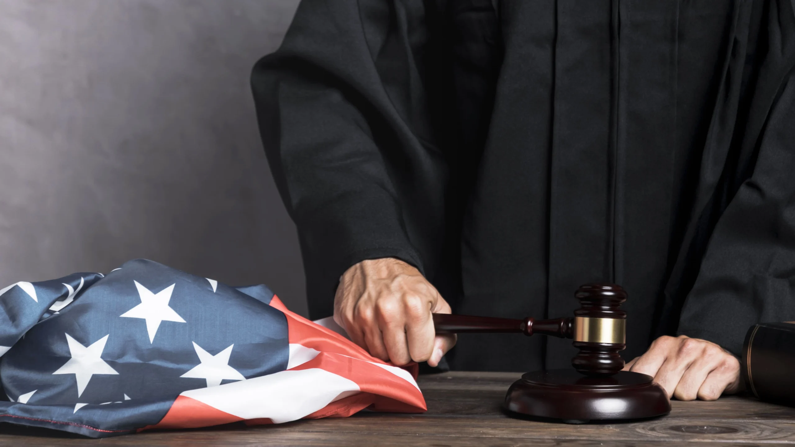 An American flag with a judge's gavel on top, illustrating the context of bond hearings in immigration court.