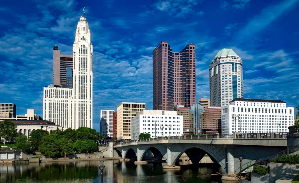 A city skyline featuring a bridge spanning a river, symbolizing connection and opportunity for Ohio immigration law.